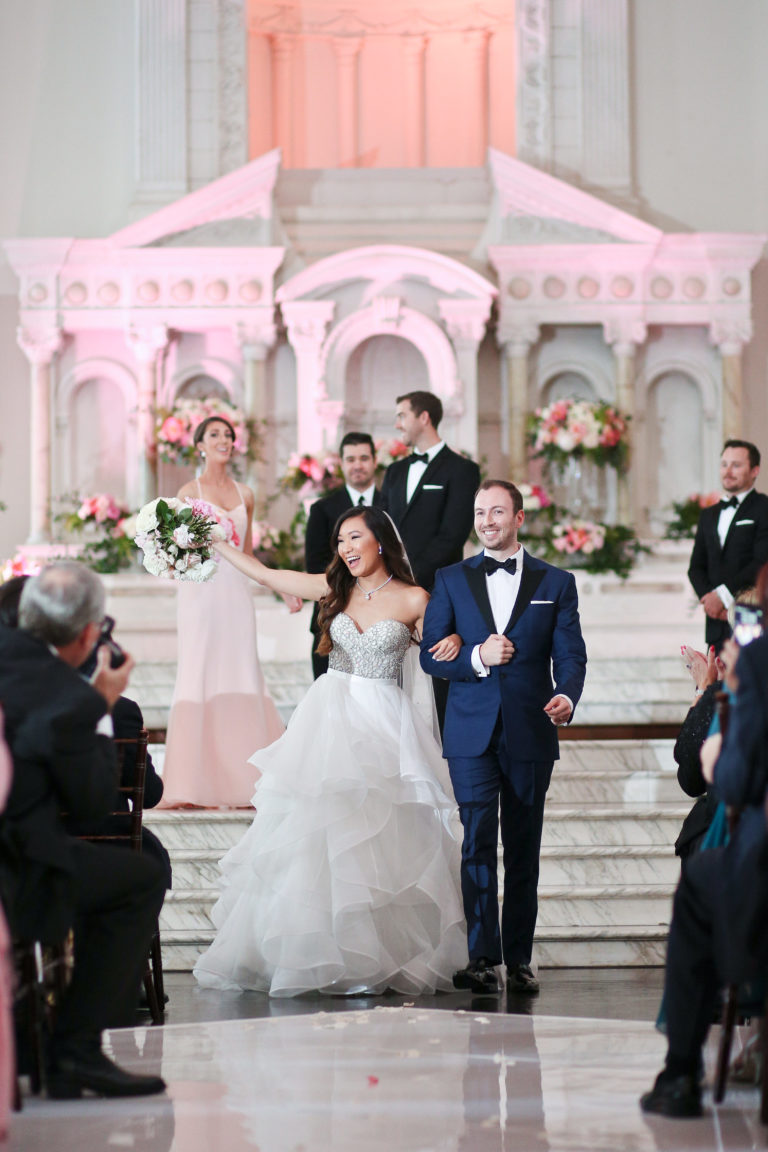 bride and groom walking down aisle