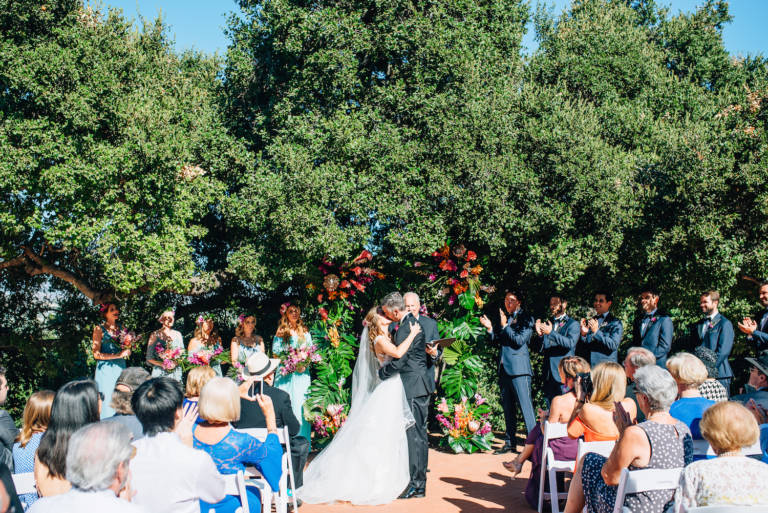 bride and groom outdoor wedding kiss