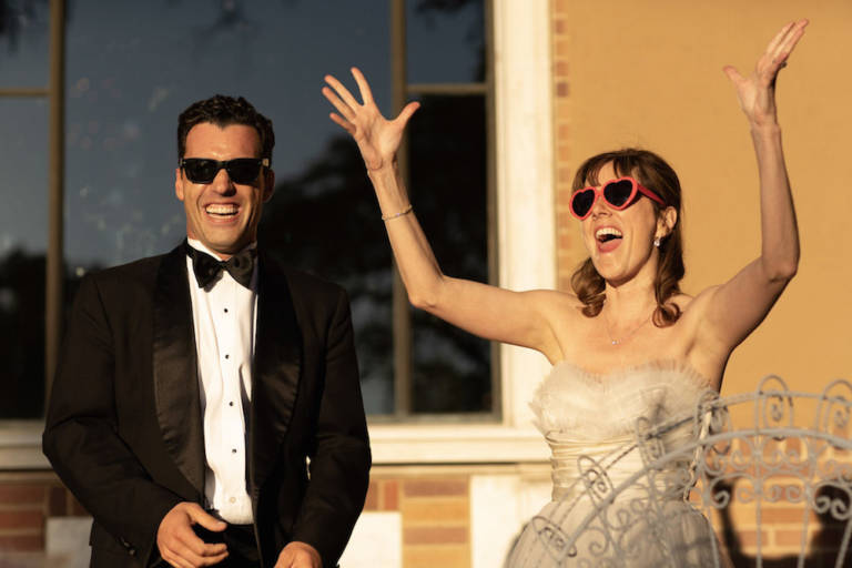 bride and groom in sunglasses