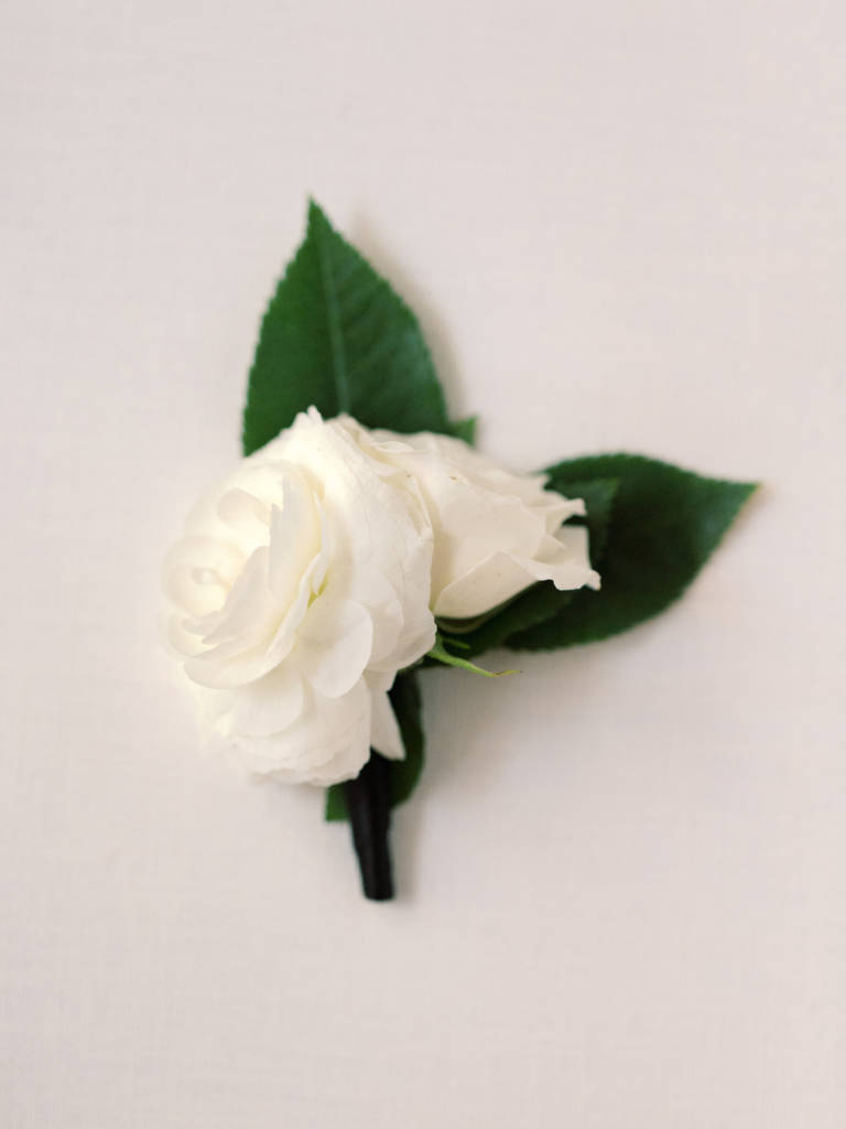 groom white boutonniere