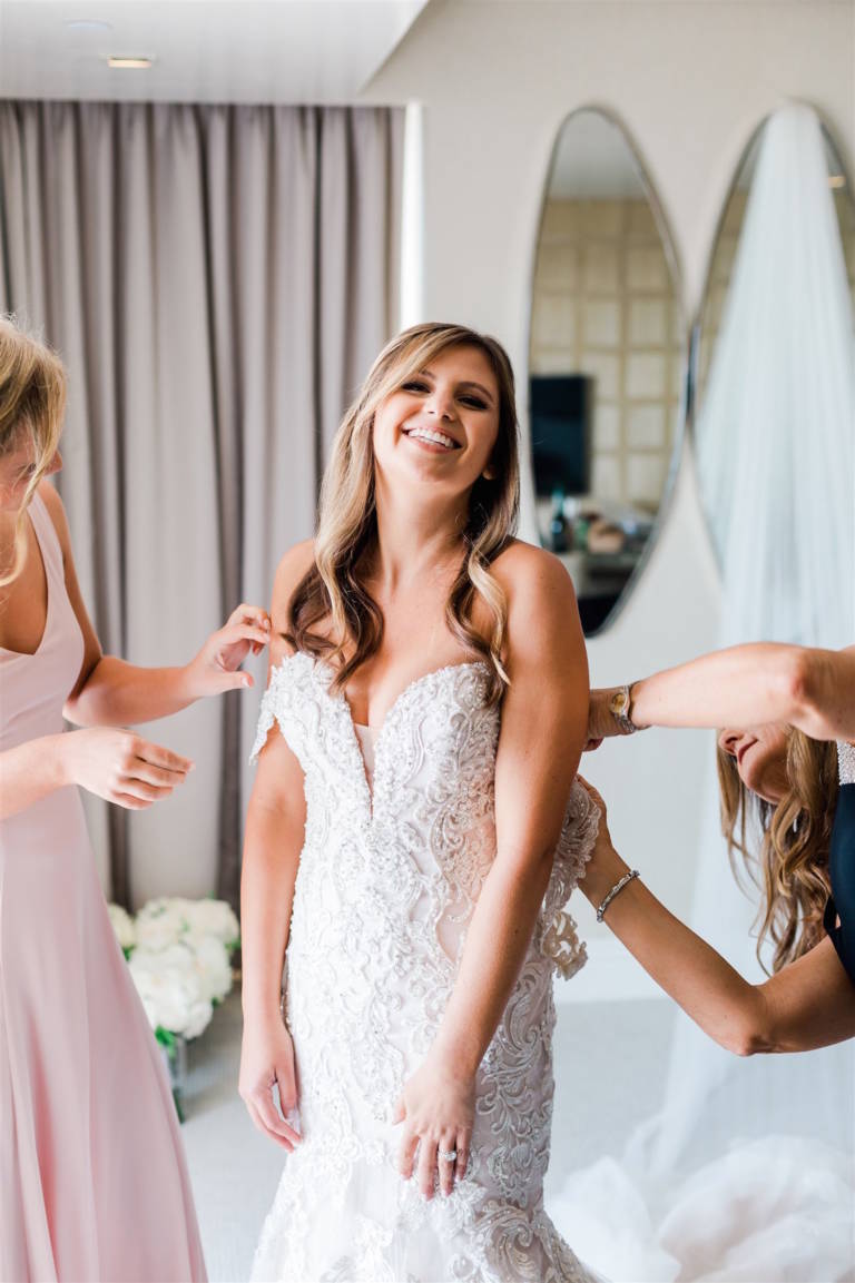 bride getting ready with help